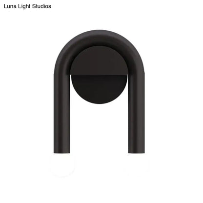 Black U-Shaped Wall Light with matte black metal arch and circular back plate on Tampa Home & Garden Store