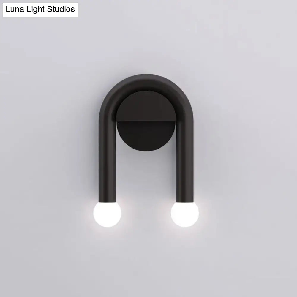Black U-shaped wall light Decorbites with bulbs on round backplate on Tampa Home & Garden Store