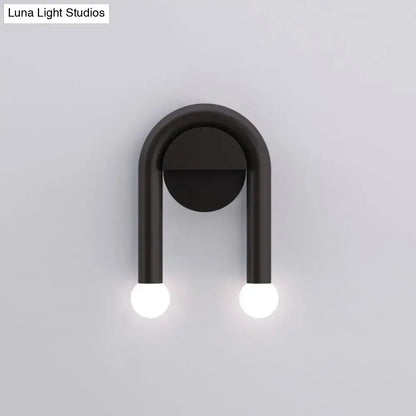 Black U-shaped wall light Decorbites with bulbs on round backplate on Tampa Home & Garden Store