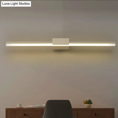 Decorbites white linear wall light with center block, modern LED fixture above desk on Tampa Home & Garden Store