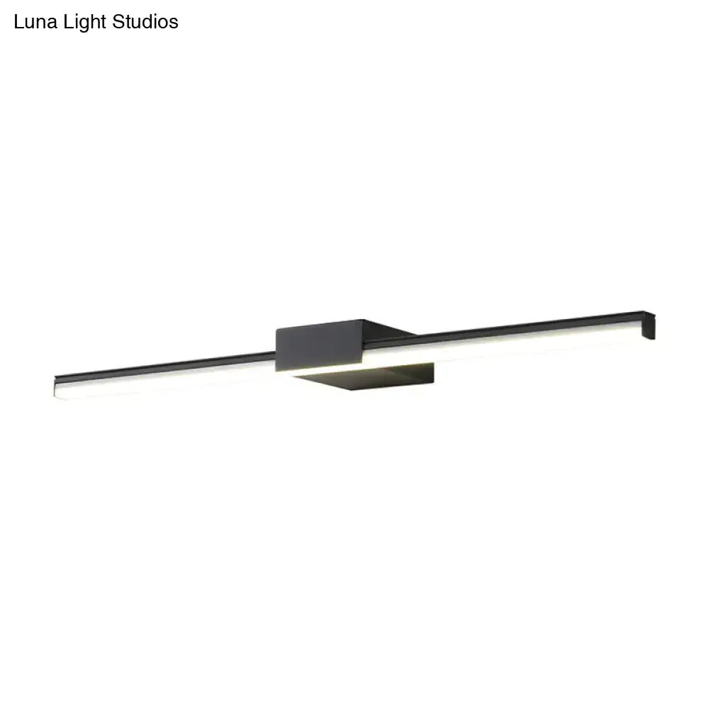 Black linear wall light with diffused white glow and central mounting block on Tampa Home & Garden Store