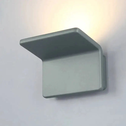 Contemporary gray LED wall lamp with rectangular base and upward angled shade on Tampa Home & Garden Store