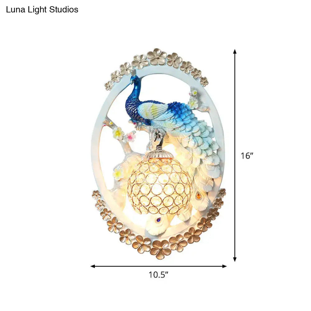 Blue Peacock Wall Sconce by Decorbites, oval frame with blue peacock and gold floral border on Tampa Home & Garden Store