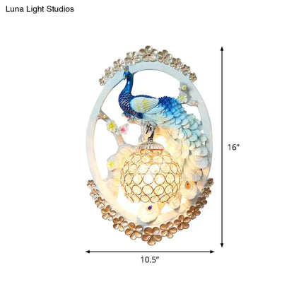 Blue Peacock Wall Sconce by Decorbites, oval frame with blue peacock and gold floral border on Tampa Home & Garden Store
