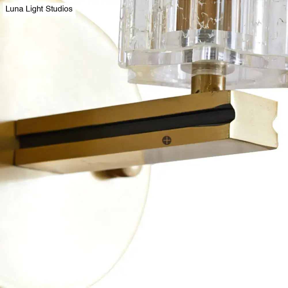 Brass crystal cylinder sconce with clear crystal shade, LED-compatible wall light on Tampa Home & Garden Store