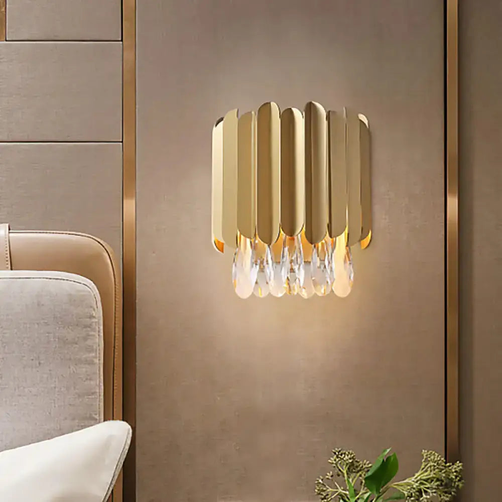 Brass crystal wall lamp with gold-tone vertical panels and hanging crystals by Decorbites on Tampa Home & Garden Store