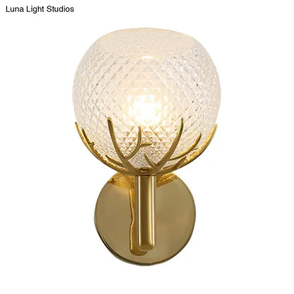 Brass Frosted Lattice Glass Sconce G9 with gold branch mount and illuminated globe on Tampa Home & Garden Store
