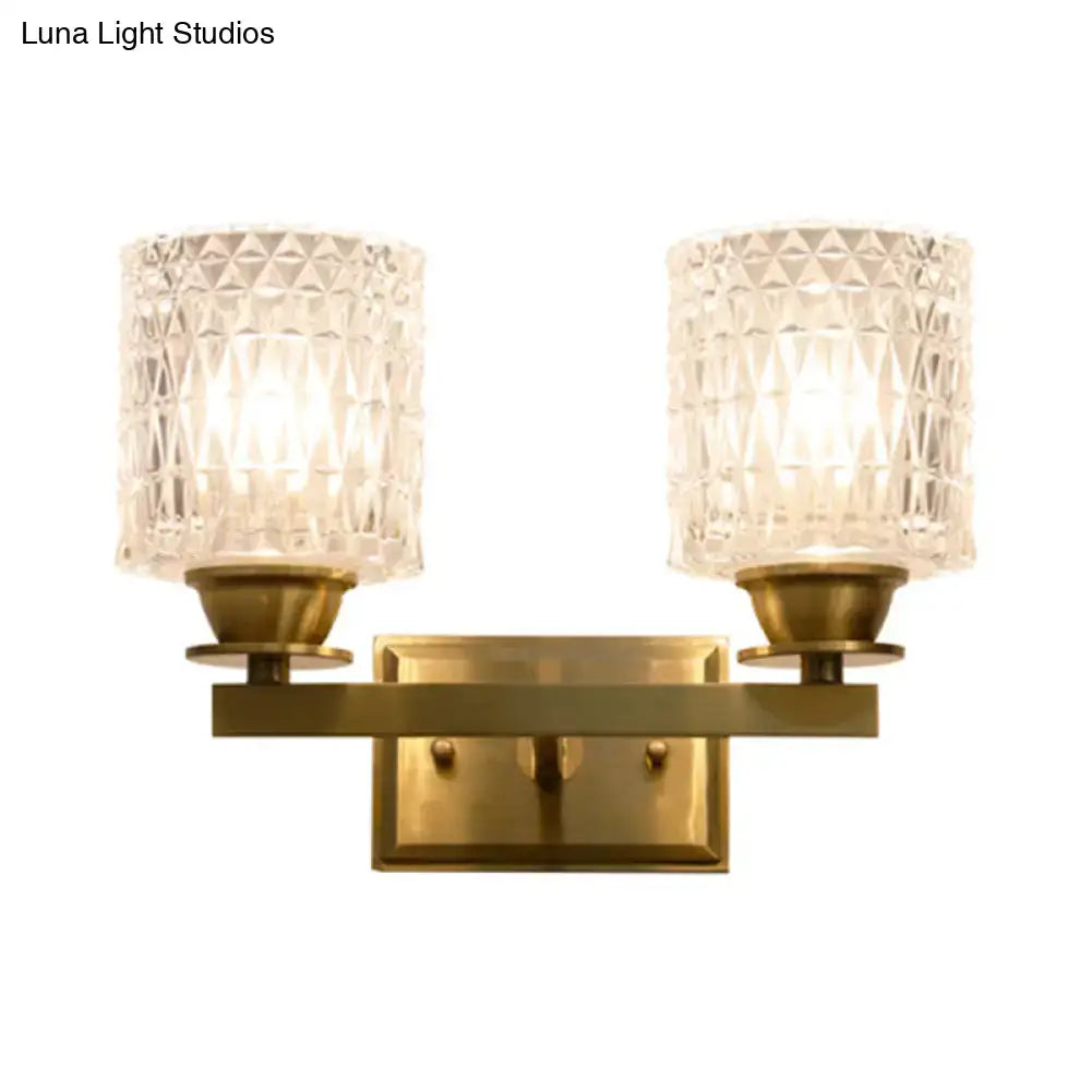 Brass lattice glass wall light by Decorbites, a two-light fixture with textured clear shades on Tampa Home & Garden Store