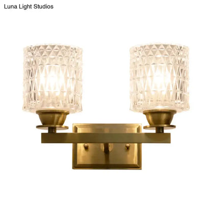 Brass lattice glass wall light by Decorbites, a two-light fixture with textured clear shades on Tampa Home & Garden Store