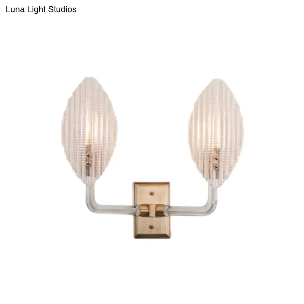 Contemporary brass leaf wall sconce with twin ribbed glass leaf shades by Decorbites on Tampa Home & Garden Store
