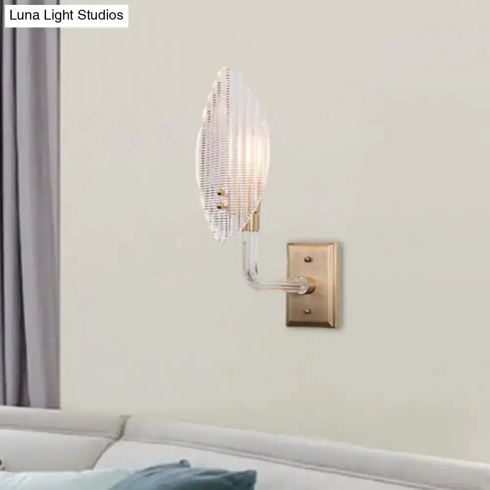 Contemporary brass leaf wall light fixture with glass sconce and brass mount plate on Tampa Home & Garden Store