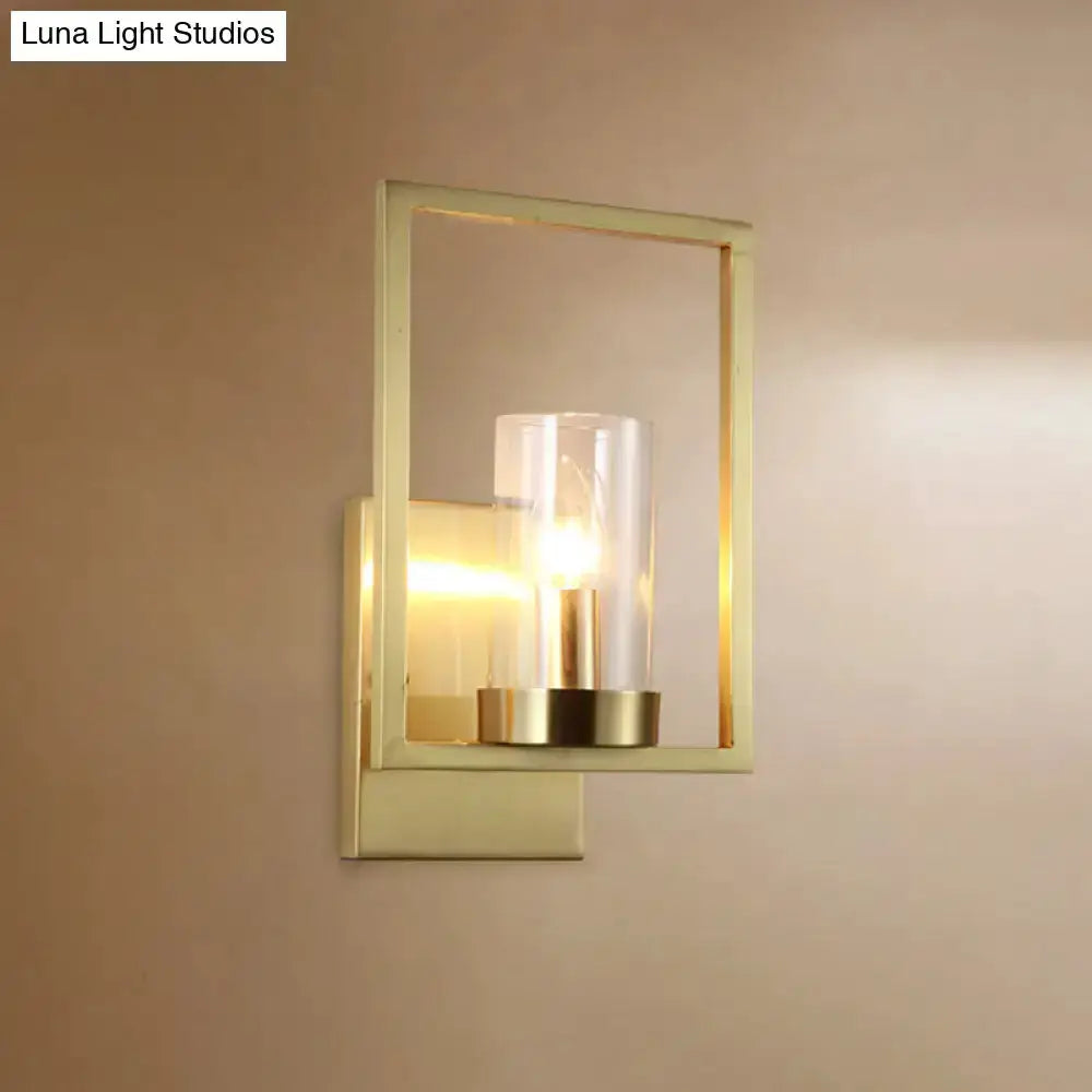 Contemporary brass wall light with clear glass cylinder shade for bedroom by Decorbites on Tampa Home & Garden Store