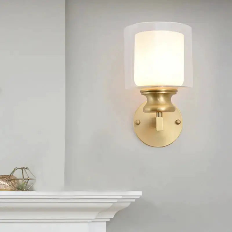 Contemporary brass wall-mounted light fixture with frosted glass shade Decorbites on Tampa Home & Garden Store