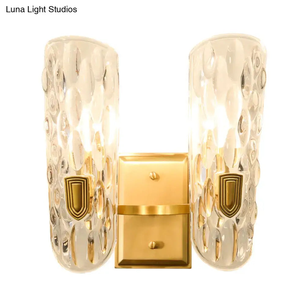 Brass water glass wall sconce with clear bubbled glass shades and gold backplate Decorbites on Tampa Home & Garden Store