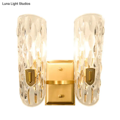 Brass water glass wall sconce with clear bubbled glass shades and gold backplate Decorbites on Tampa Home & Garden Store