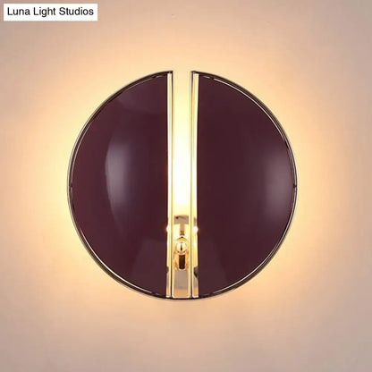 Decorbites Burgundy Gold Wall Sconce, circular burgundy glass with gold center, warm glow on Tampa Home & Garden Store