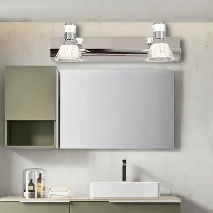 Contemporary chrome conic sconce lights with crystal glass shades above bathroom vanity on Tampa Home & Garden Store