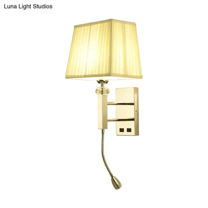 Contemporary gold wall sconce with beige fabric shade and adjustable reading arm on Tampa Home & Garden Store