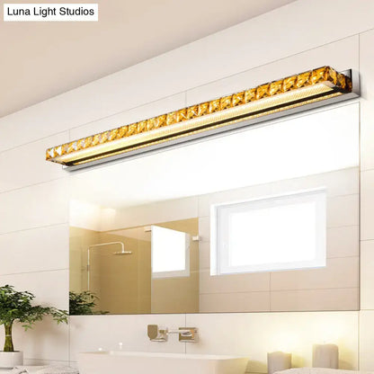 Decorbites contemporary crystal gold wall sconce with warm white LED over bathroom mirror on Tampa Home & Garden Store