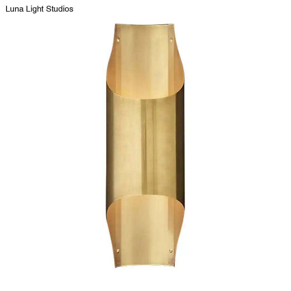 Decorbites brass curved single-head wall lamp with a vertical cylindrical body and end caps on Tampa Home & Garden Store