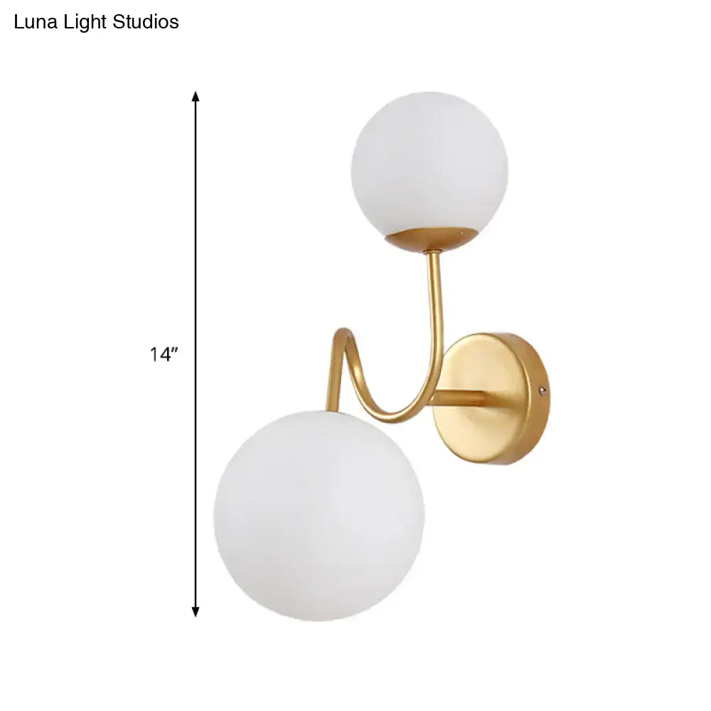 Gold glass wall sconce with two adjustable heads and two white glass globes by Decorbites on Tampa Home & Garden Store