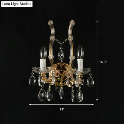 Amber crystal gold accent wall light by Decorbites; dual candle bulbs, hanging crystals on Tampa Home & Garden Store