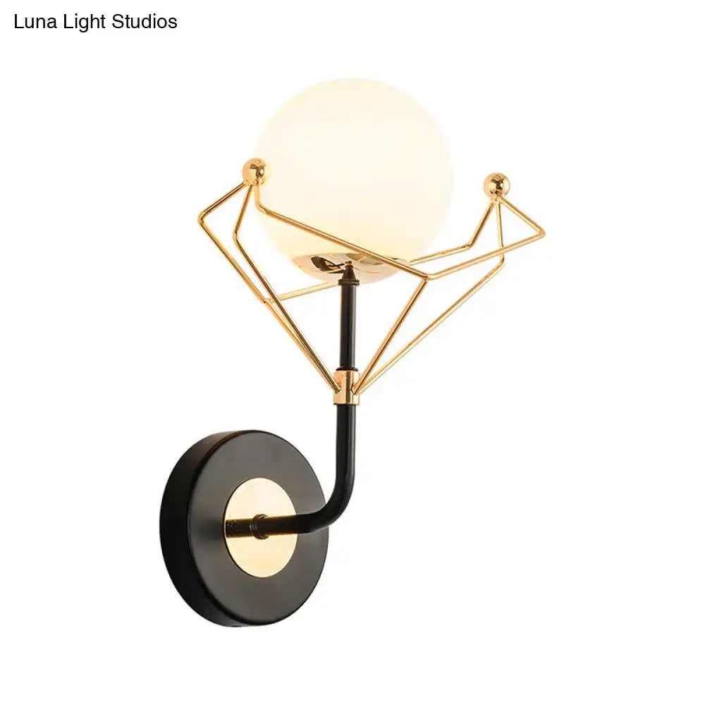 Gold glass orb sconce with geometric gold wire frame and black wall mount Decorbites on Tampa Home & Garden Store
