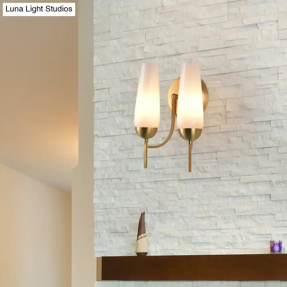 Decorbites gold opal conical sconce with frosted shades in brass finish on stacked stone on Tampa Home & Garden Store
