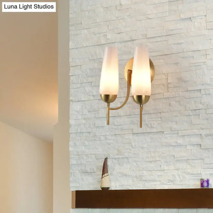 Decorbites gold opal conical sconce with frosted shades in brass finish on stacked stone on Tampa Home & Garden Store