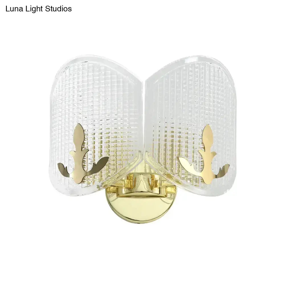 Contemporary gold arc glass wall sconce with curved panels and brass mount on Tampa Home & Garden Store
