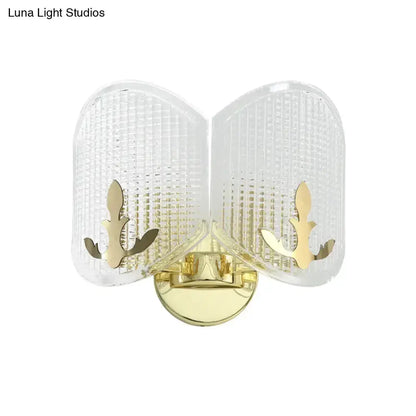 Contemporary gold arc glass wall sconce with curved panels and brass mount on Tampa Home & Garden Store