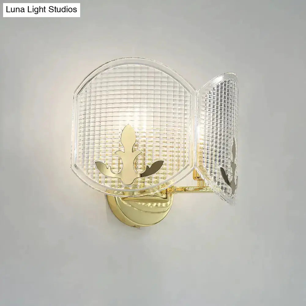 Decorbites gold arc glass wall sconce with fleur-de-lis motif for living room lighting on Tampa Home & Garden Store