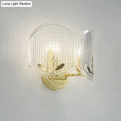 Decorbites gold arc glass wall sconce with fleur-de-lis motif for living room lighting on Tampa Home & Garden Store