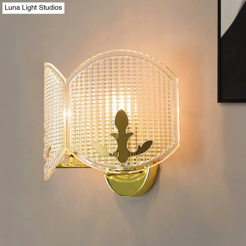 Decorbites contemporary gold arc glass wall sconce with panels and fleur-de-lis ornament on Tampa Home & Garden Store