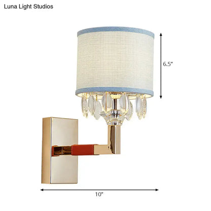 Gold crystal fabric shade sconce by Decorbites, wall mounted with blue trim and crystal drops on Tampa Home & Garden Store