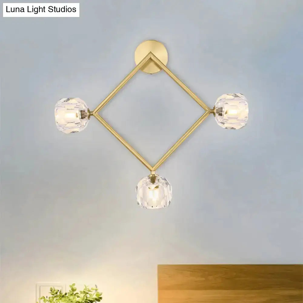 Contemporary gold brass wall light fixture with diamond frame and four crystal prisms on Tampa Home & Garden Store