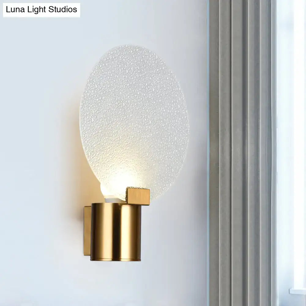 Decorbites gold bubble glass sconce with frosted disc and brass cylindrical wall mount on Tampa Home & Garden Store