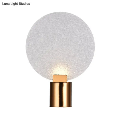 Gold bubble glass sconce with brass cylindrical base and frosted shade on Tampa Home & Garden Store