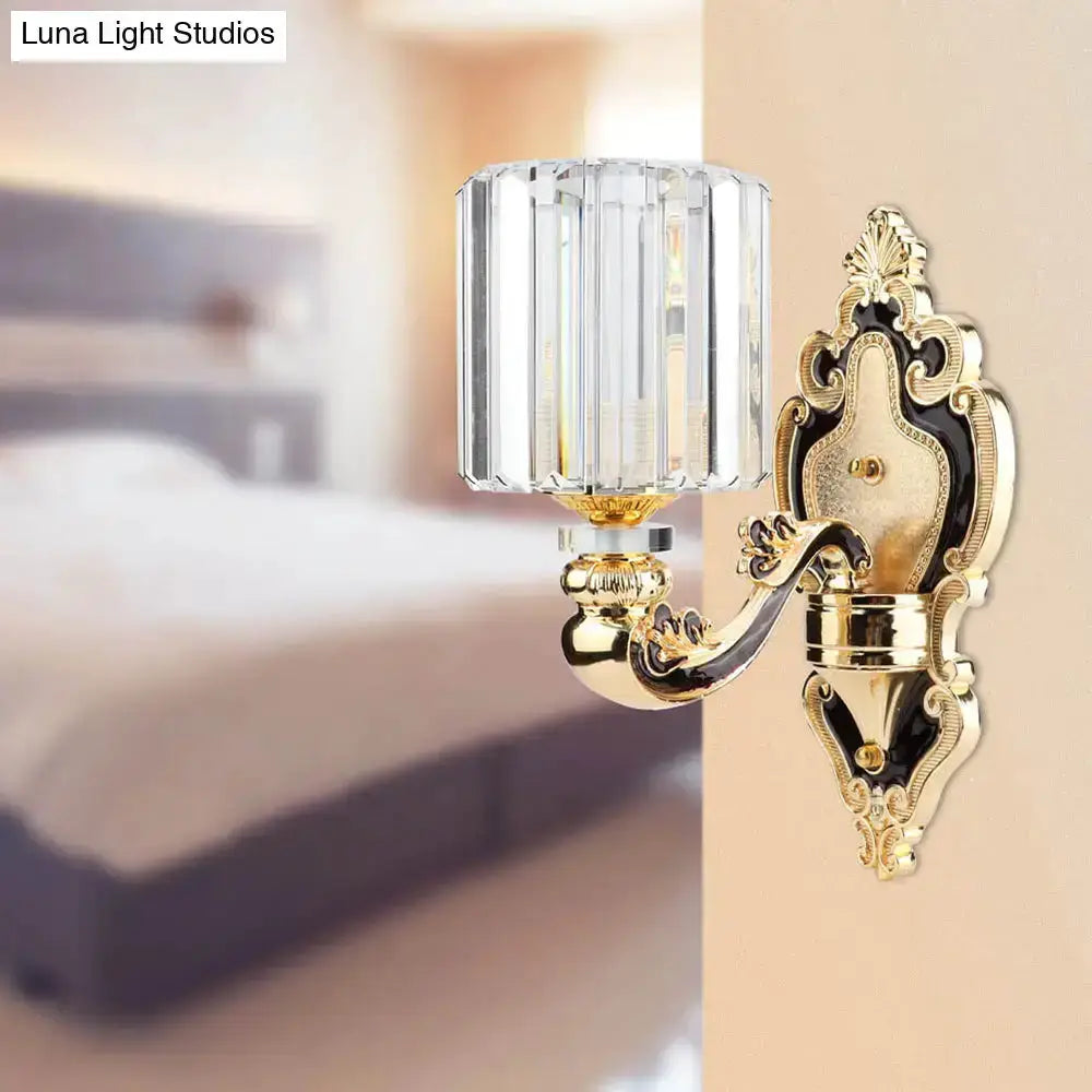 Contemporary gold crystal cylinder wall sconce by Decorbites with ornate brass backplate on Tampa Home & Garden Store