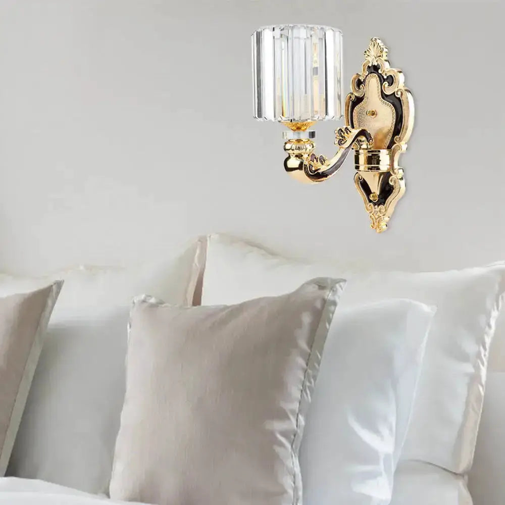 Contemporary gold crystal cylinder wall sconce by Decorbites with ornate backplate on Tampa Home & Garden Store