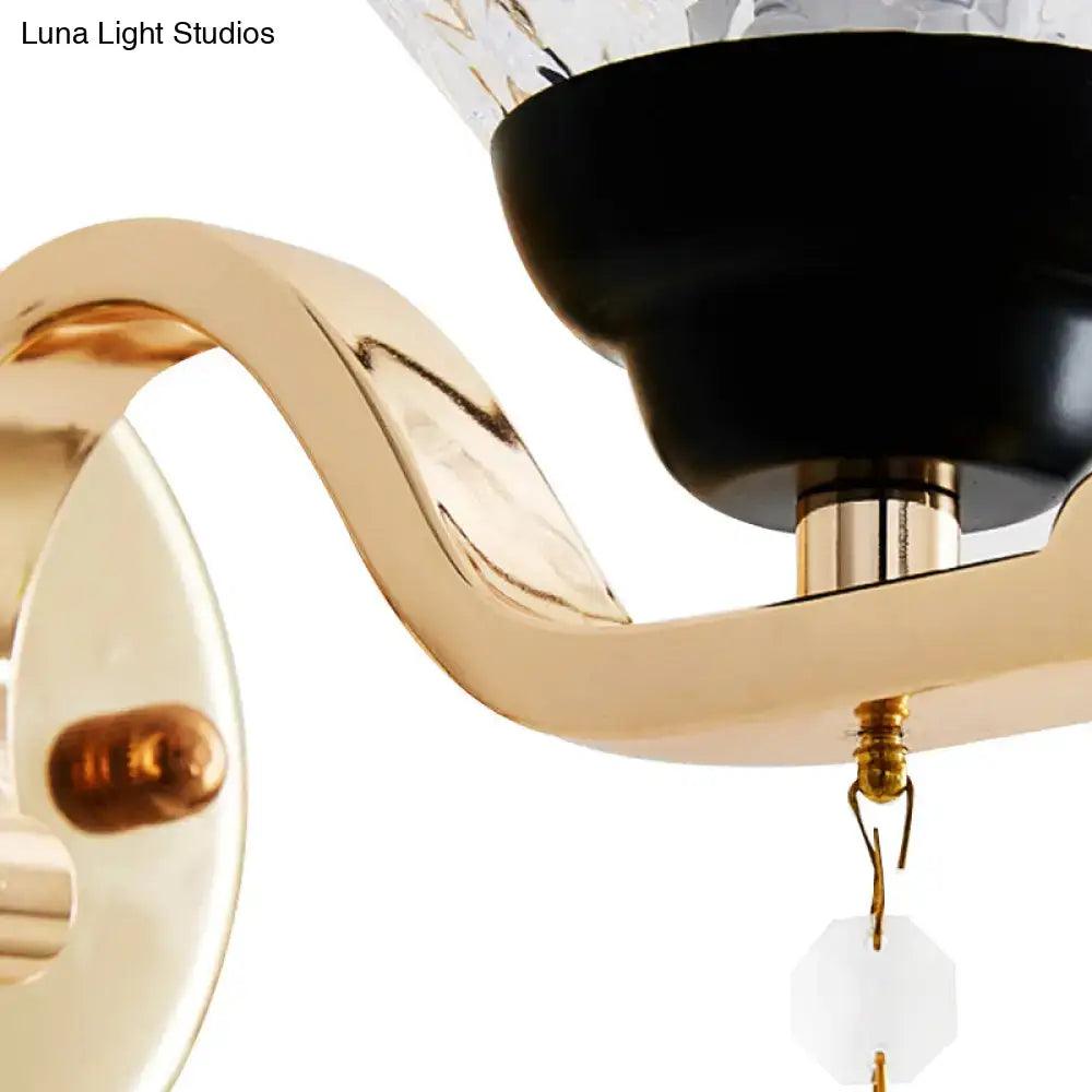 Chrome teardrop wall sconce with dimmable glow; gold curved arm, black canopy, Decorbites on Tampa Home & Garden Store