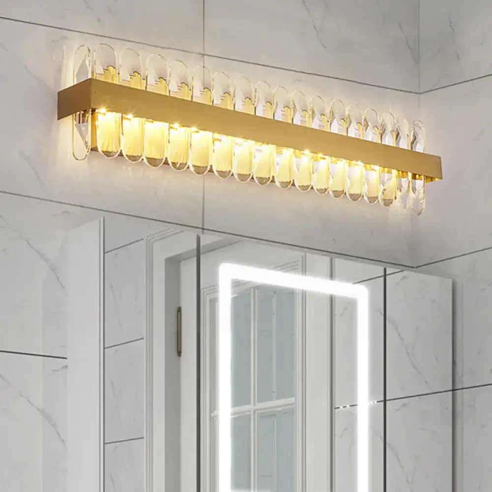 Gold crystal LED wall lamp by Decorbites with a gold bar and crystal loop accents on Tampa Home & Garden Store