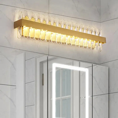 Gold crystal LED wall lamp by Decorbites with a gold bar and crystal loop accents on Tampa Home & Garden Store