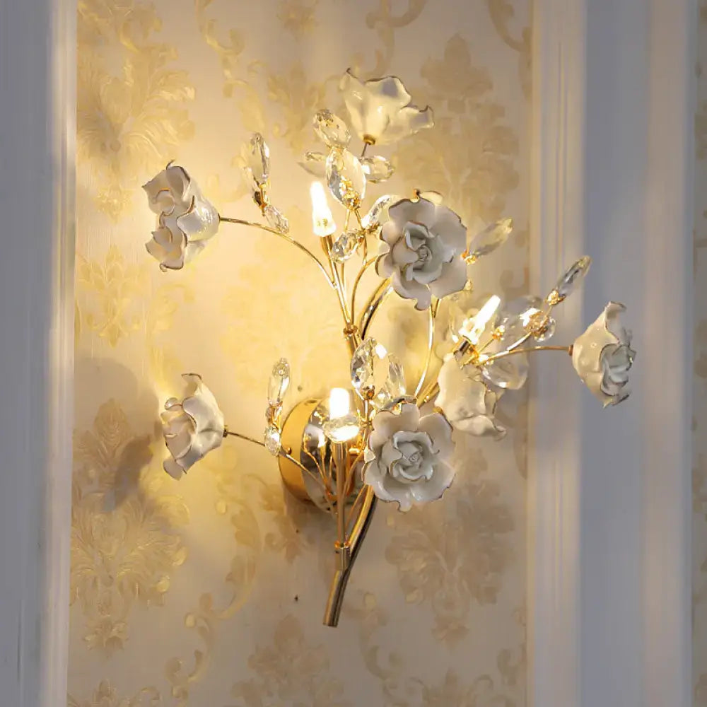 Gold crystal porcelain lamp sconce with white roses and crystal droplets by Decorbites on Tampa Home & Garden Store