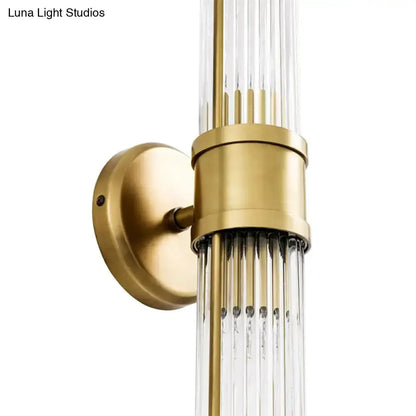 Contemporary gold crystal wall sconce with clear glass prisms and brass cylindrical body on Tampa Home & Garden Store