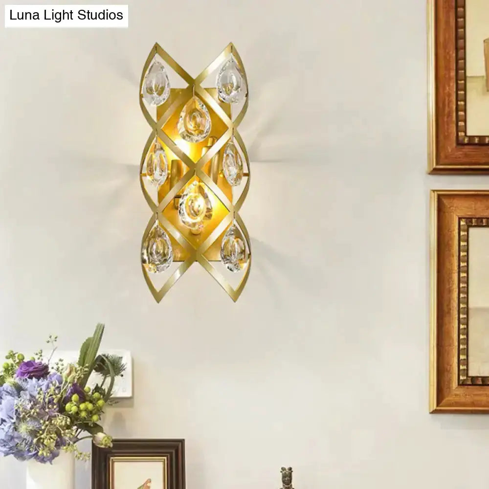 Contemporary gold geometric teardrop sconce with clear crystal accents on Tampa Home & Garden Store
