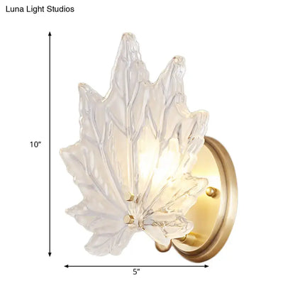 Gold Crystal Maple Leaf Wall Sconce with brass backplate, warm LED glow on Tampa Home & Garden Store