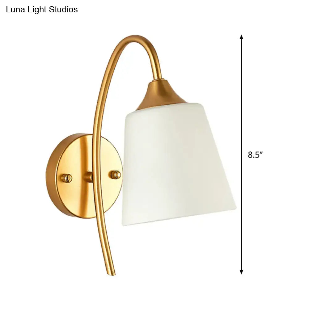 Gold milk glass tapered bedroom wall sconce by Decorbites with curved brass arm on Tampa Home & Garden Store