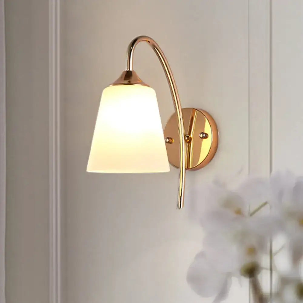 Gold milk glass tapered bedroom sconce by Decorbites with brass curved arm on Tampa Home & Garden Store