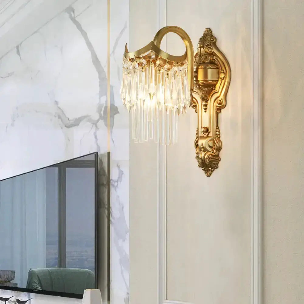 Contemporary gold wall lamp with clear crystal prisms and ornate backplate by Decorbites on Tampa Home & Garden Store
